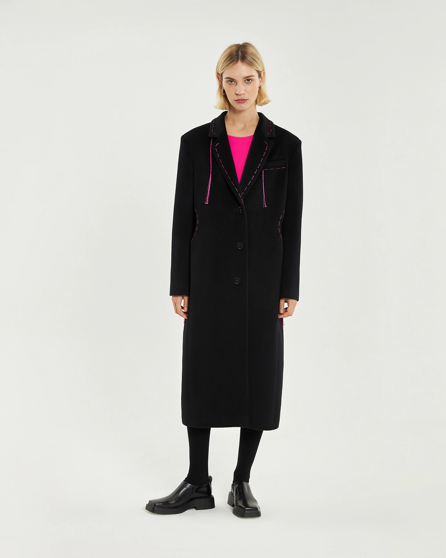Coat with cutouts at the waist
