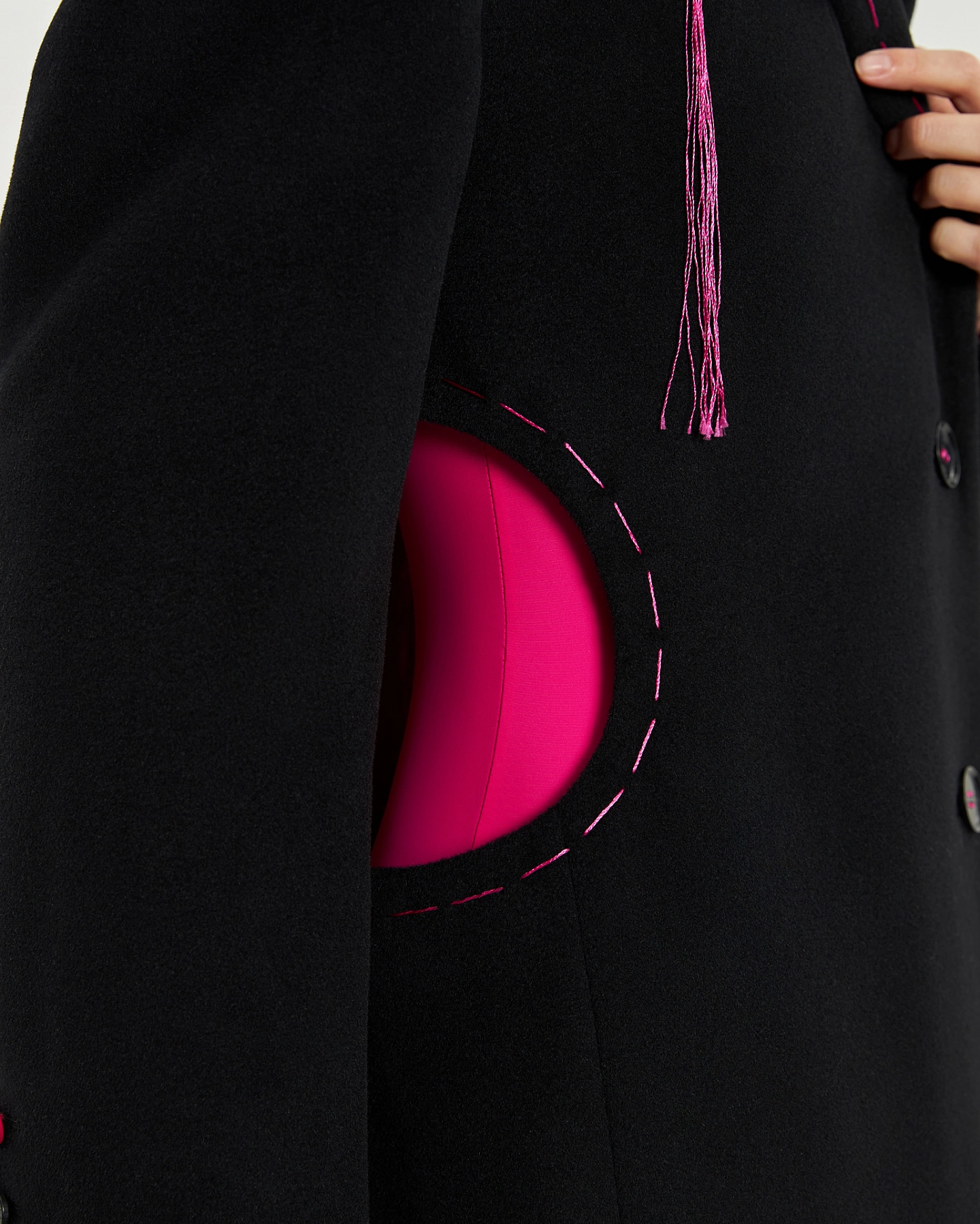 Coat with cutouts at the waist