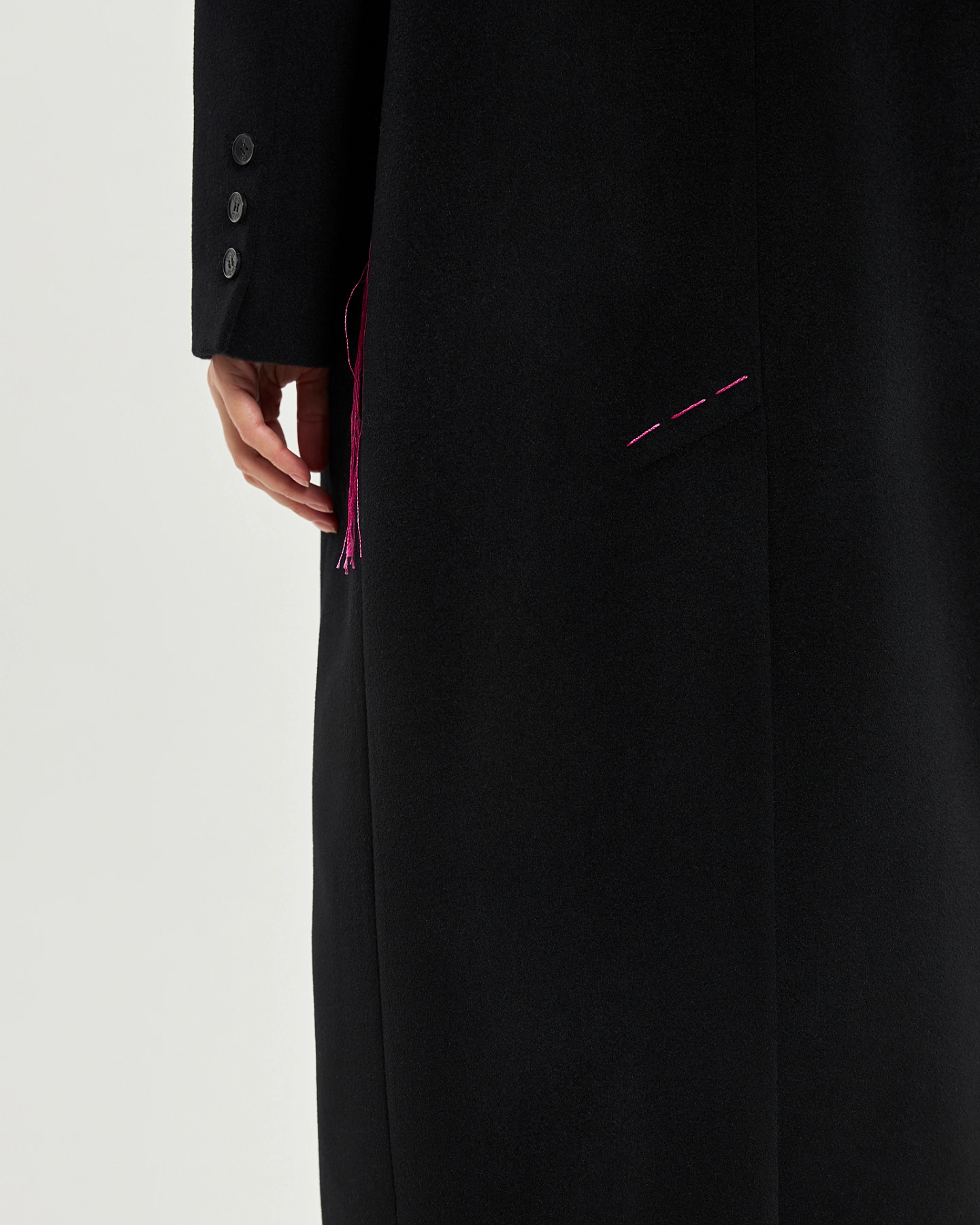 Coat with cutouts at the waist