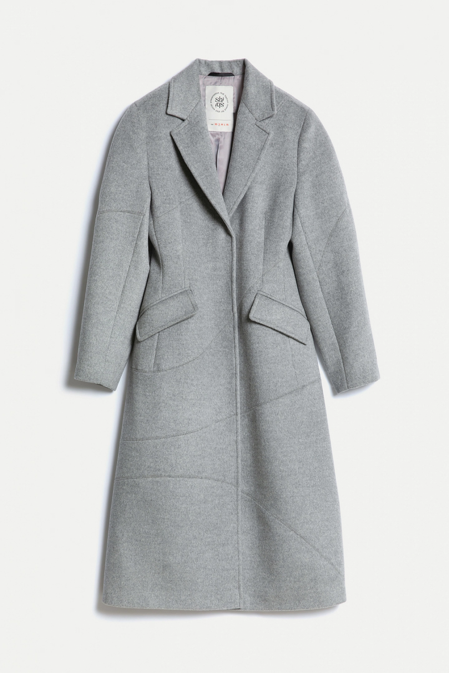 Coat with decorative seams