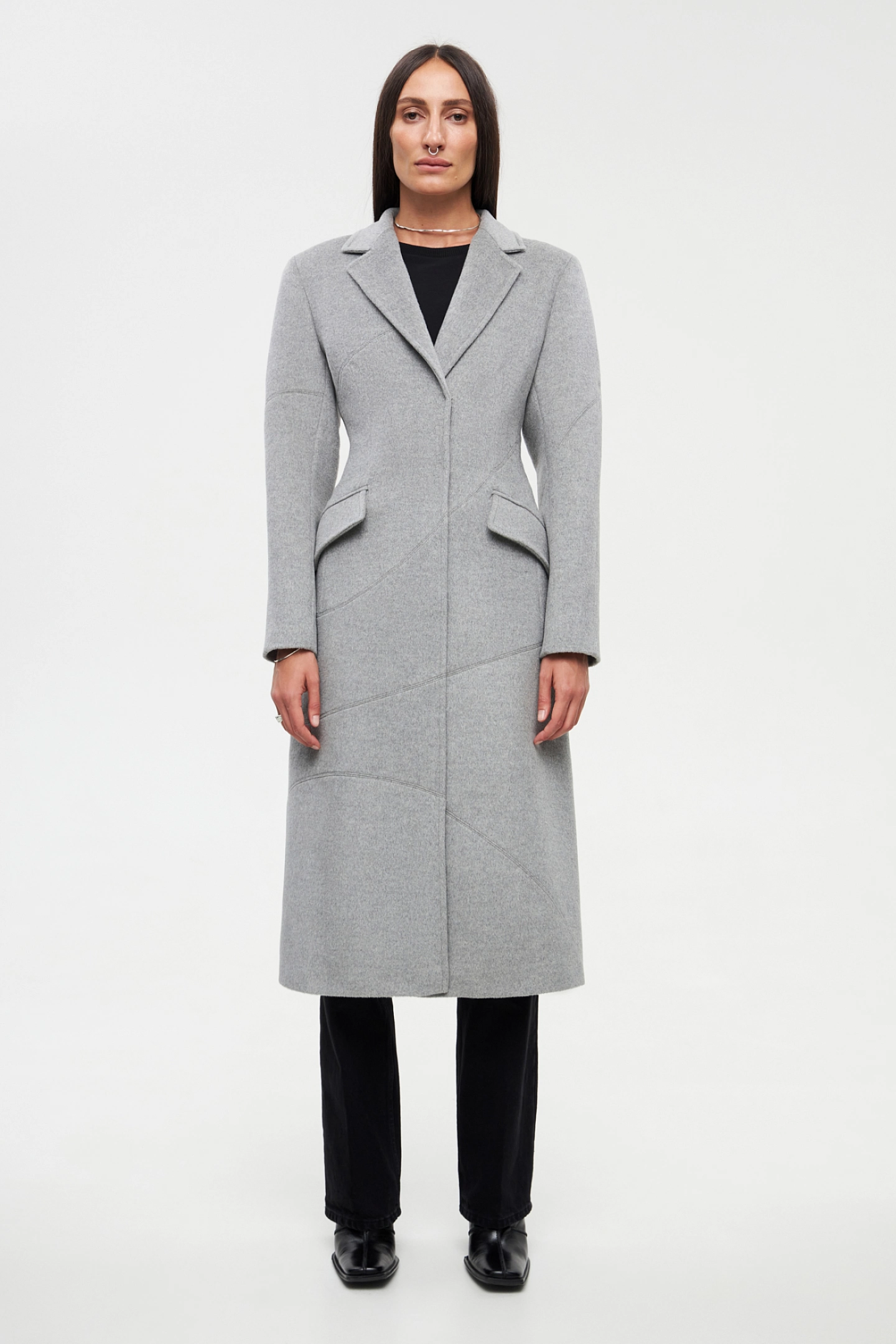 Coat with decorative seams