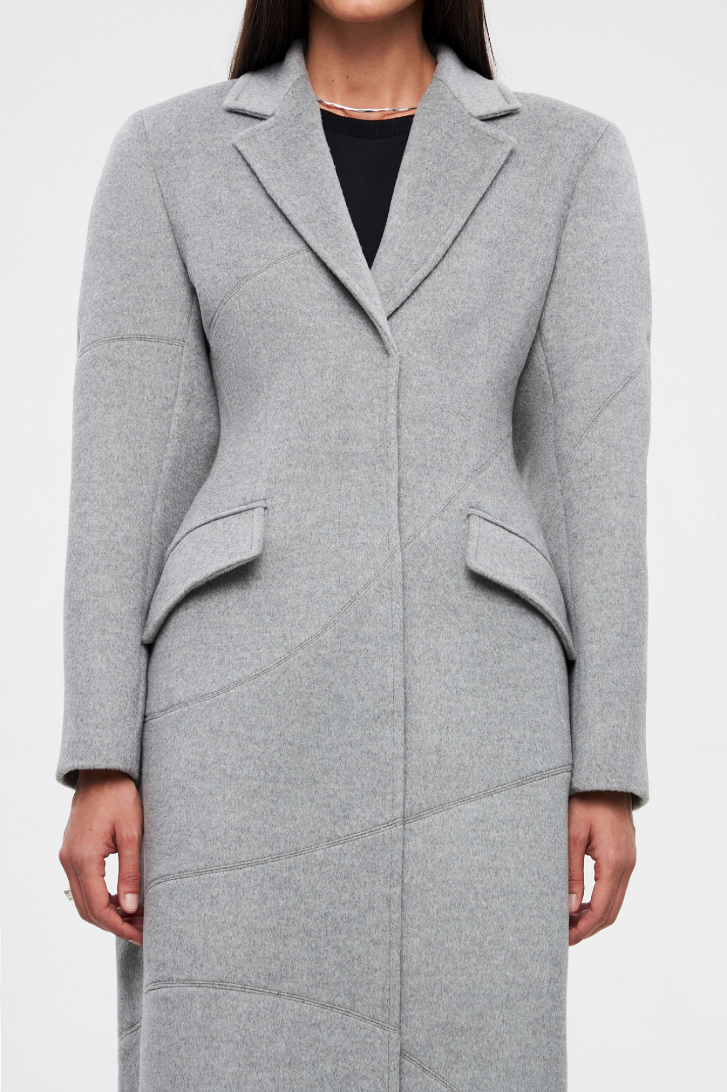 Coat with decorative seams