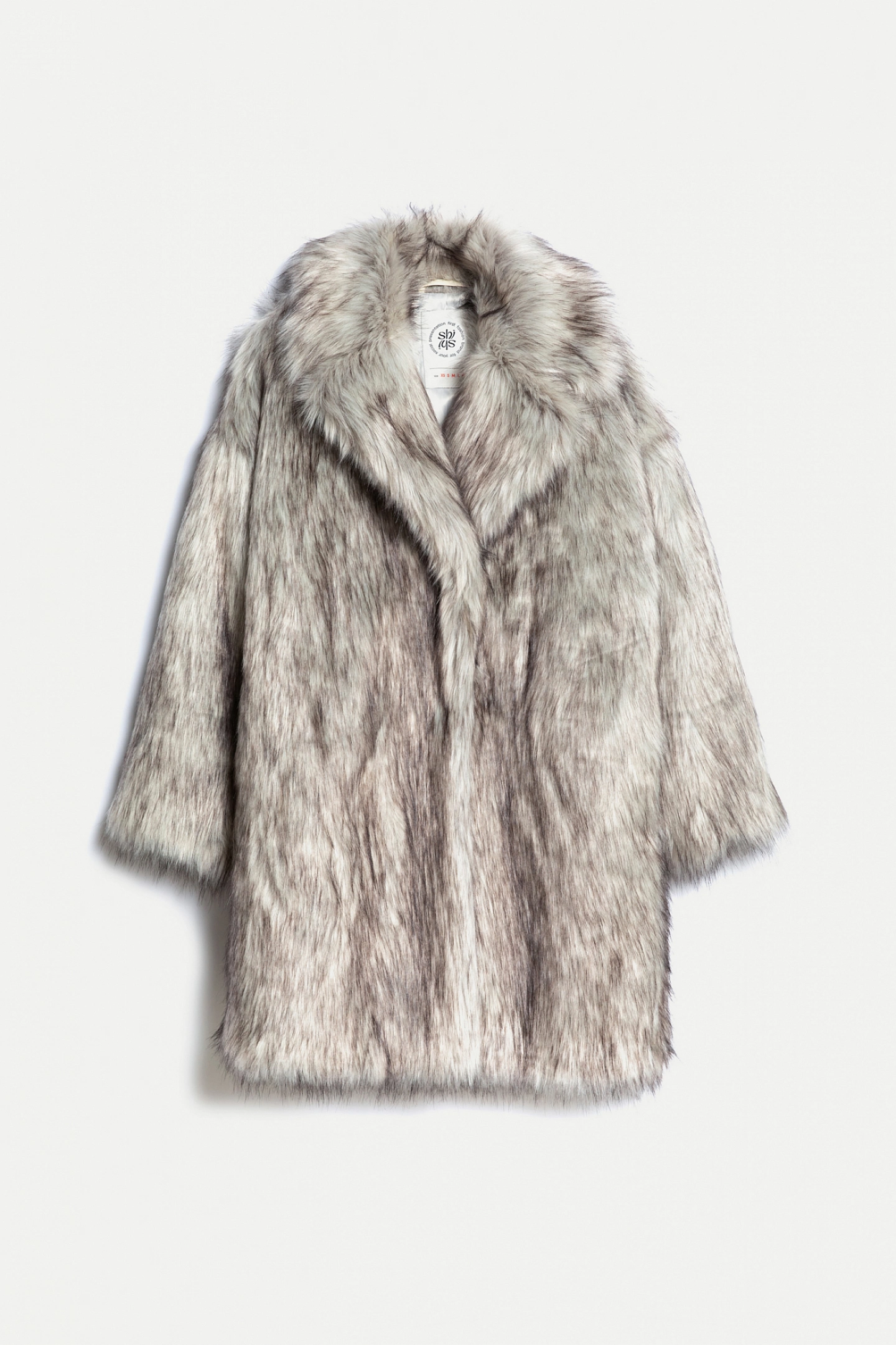 Double-breasted fur coat with a lowered shoulder