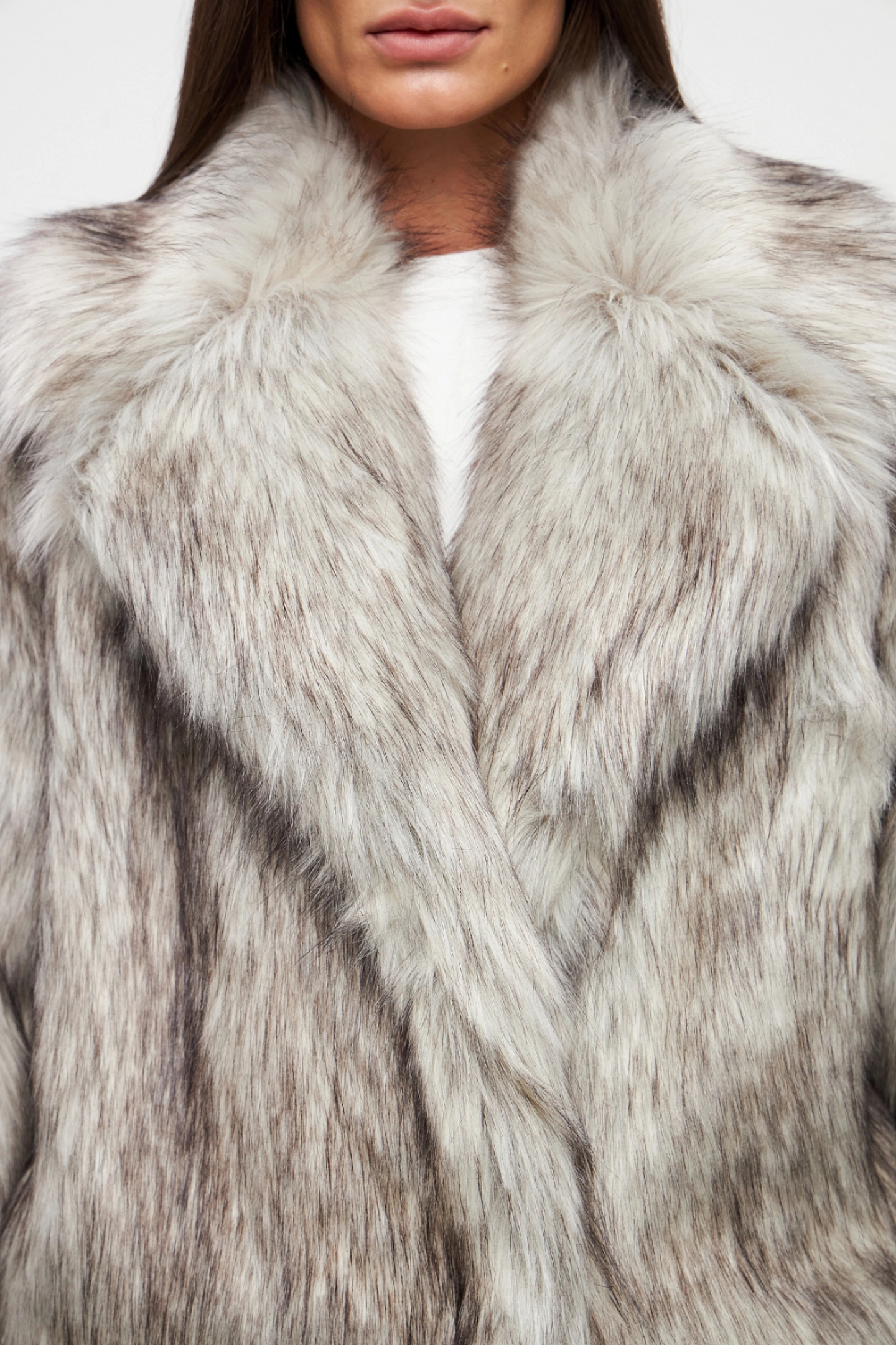 Double-breasted fur coat with a lowered shoulder