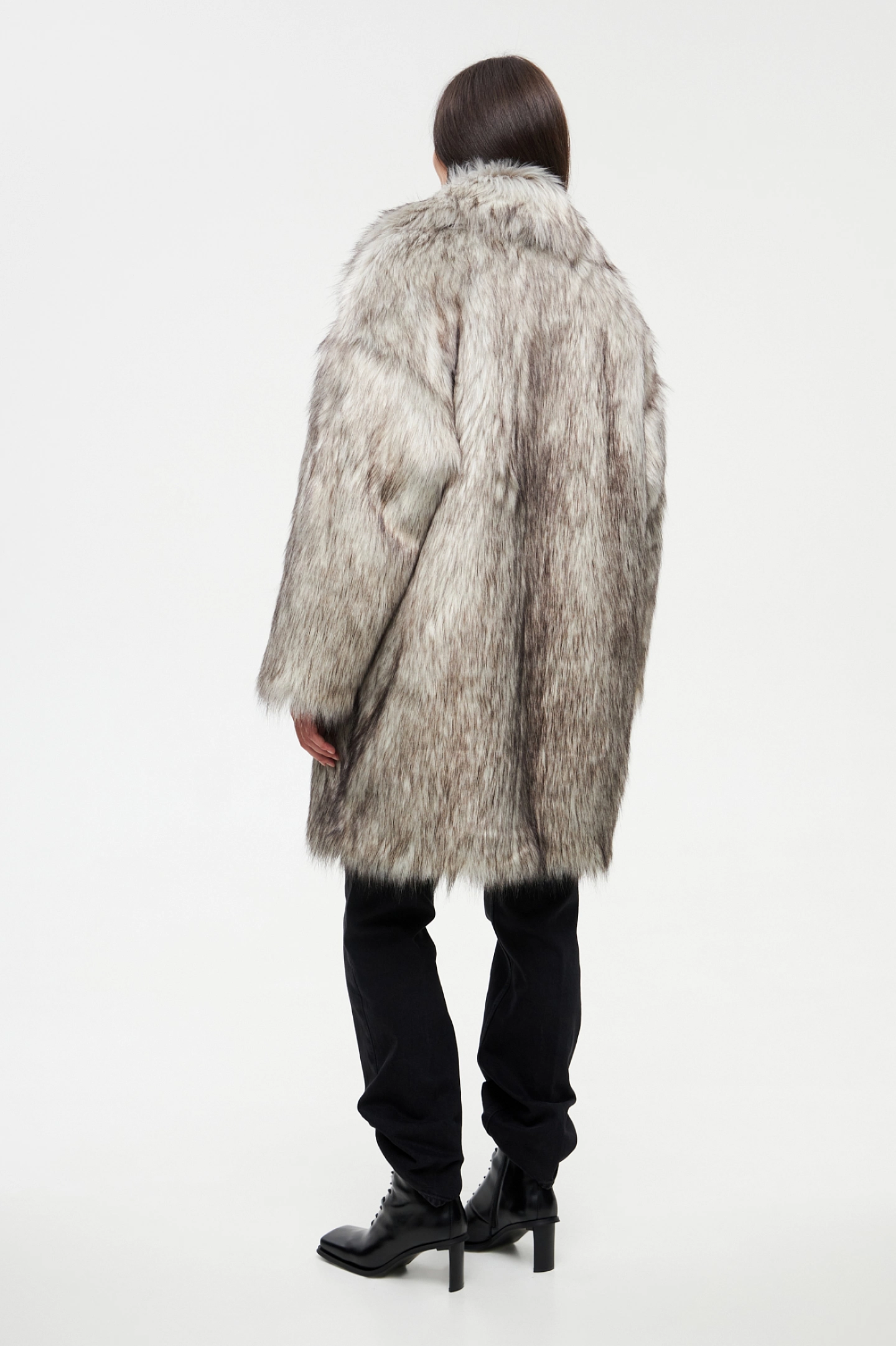 Double-breasted fur coat with a lowered shoulder