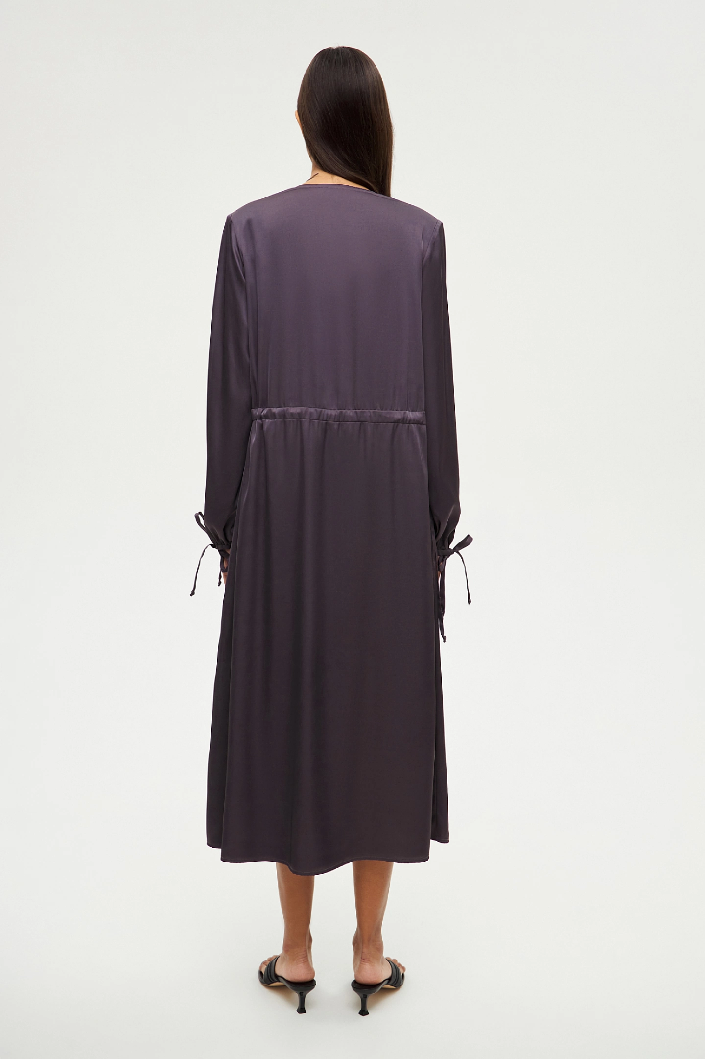 Dress with a pleat